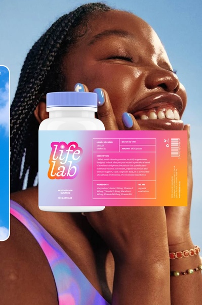 A close-up aesthetic shot of a model holding a bottle of multivitamin gummies against a bright blue sky background.